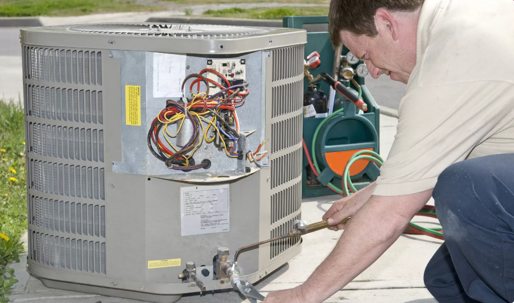 technician working on an hvac unit
