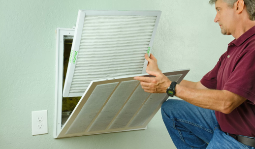 technician replacing air filter