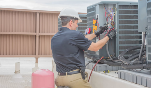 technician working on hvac unit